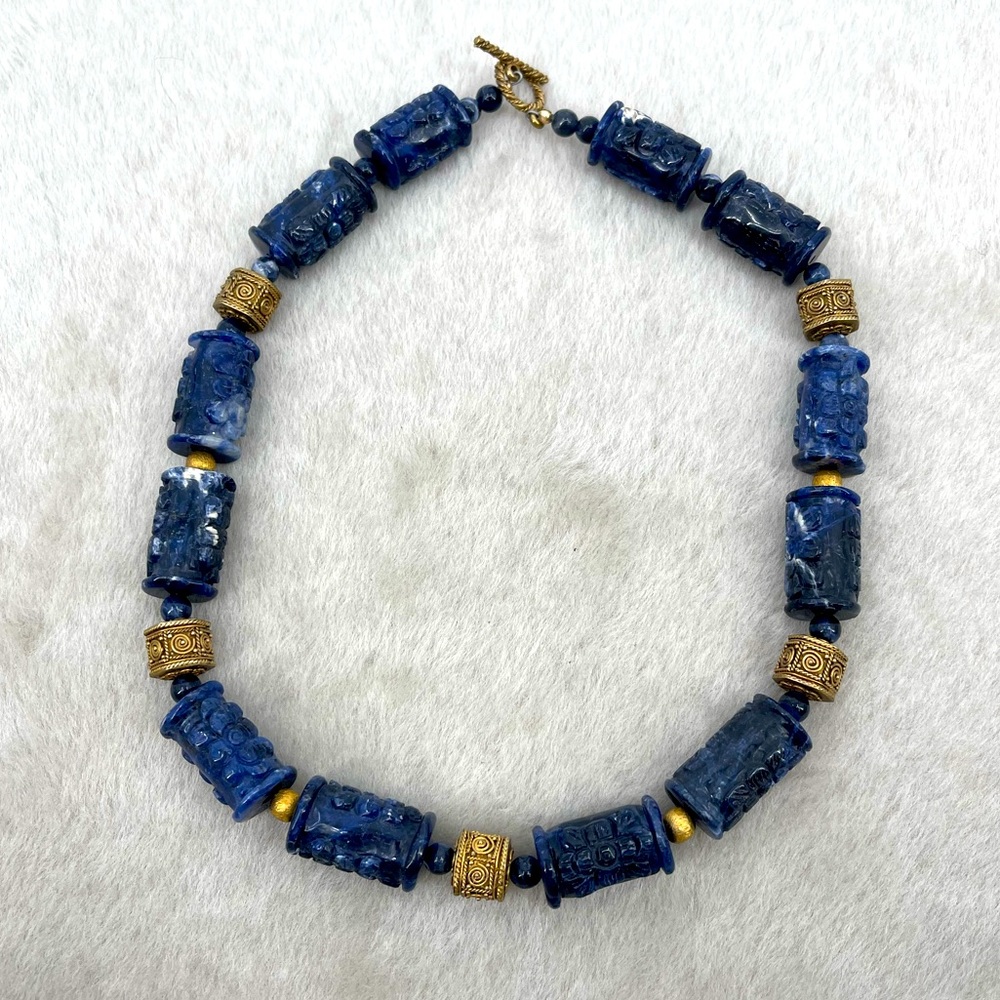 Dark blue Sodalite stone hand engraved with brass details neckless.